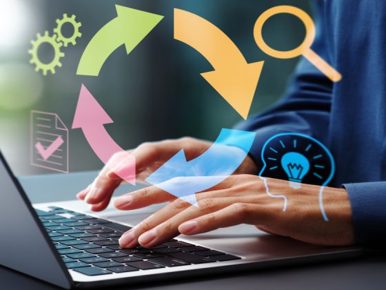Agile feedback loop concept with a businessman using a laptop, illustrating iterative cycles and continuous improvement in project management.