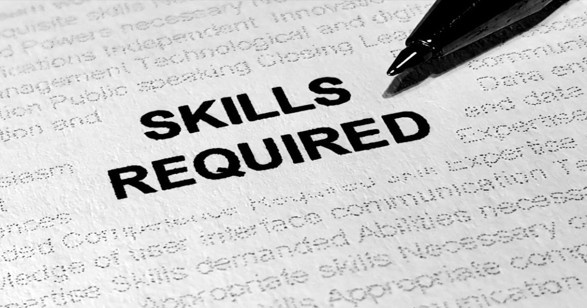 "Skills required" printed on a job description, illustrating skills-based hiring over degree requirements.