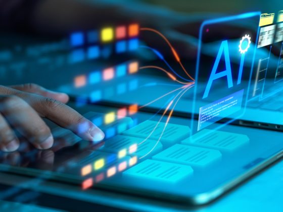 AI-powered automation in IT concept with a hand using a tablet and a holographic AI interface